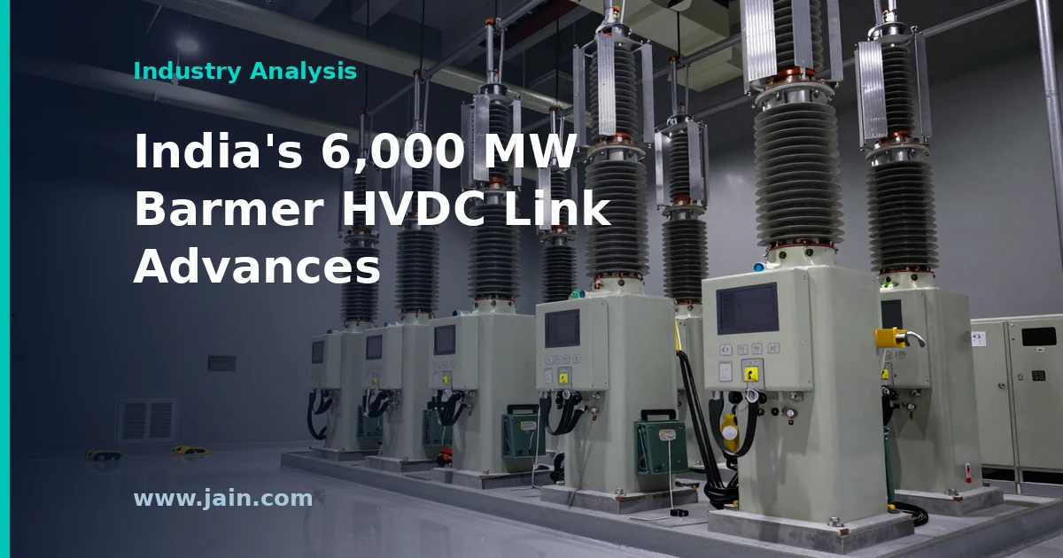 HVDC converter station and high-voltage transmission towers crossing Rajasthan desert near solar farms for Barmer HVDC project