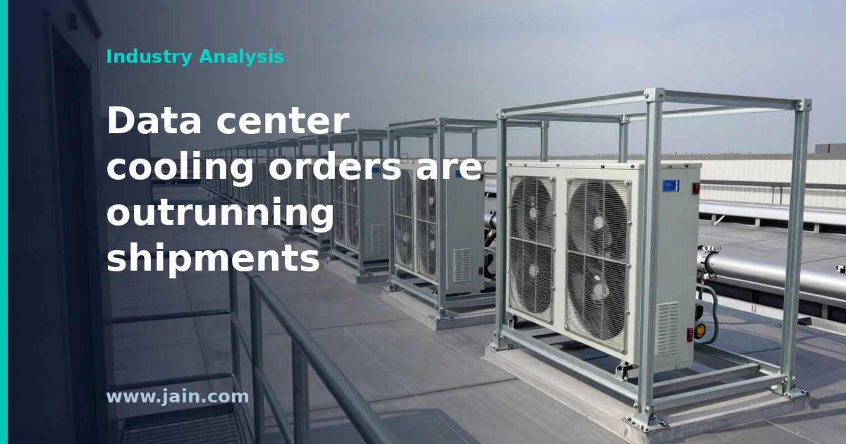 Rows of large rooftop chillers cooling a data center, illustrating Johnson Controls' $23.0 billion backlog and 44% order growth